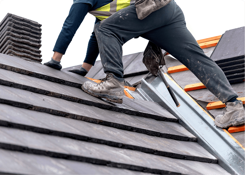 Construction worker on sloped roof